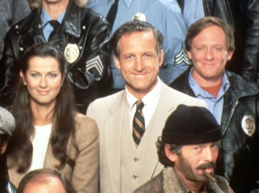 Daniel J. Travanti in the beige suit in Hill Street Blue publicity photo.